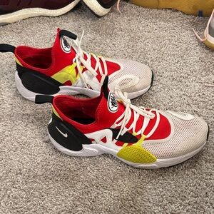 Nike Kids Vibrant Red, Yellow, and Black Sneakers